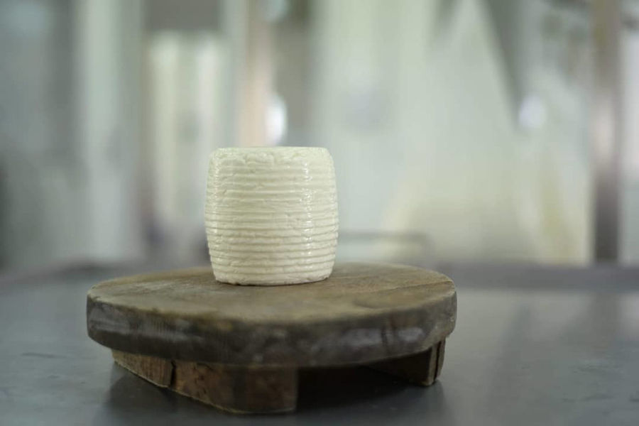 'Mykonos Farmers' cheese ball on the wood plate